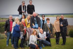 A Berry Wine Tasting Day Tour at Two Figs Winery taking a group photo with the Shoalhaven River in the background