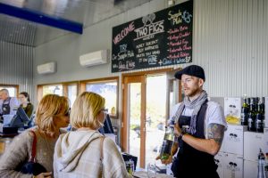 A group enjoying a wine tasting at Two Figs Winery