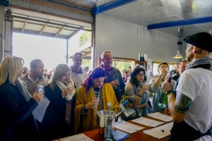 A group enjoying a wine tasting on a Sydney Wine Tasting Tour at Two Figs Winery