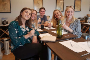 Group enjoying wine tasting on best tour from sydney